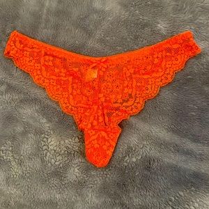 Size large coral colored thong.